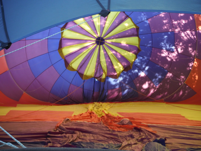 The balloon as it’s being filled with air.